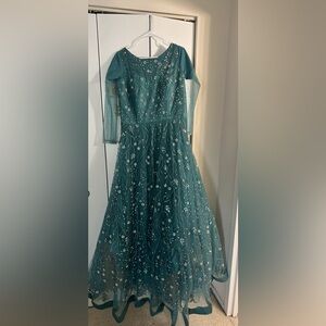 A blue maxi dress with delicate silver light work.